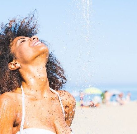 How should I take care of my frizzy hair at the beach?