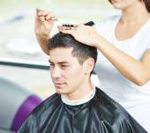 Should men’s hair be cut when wet or dry?